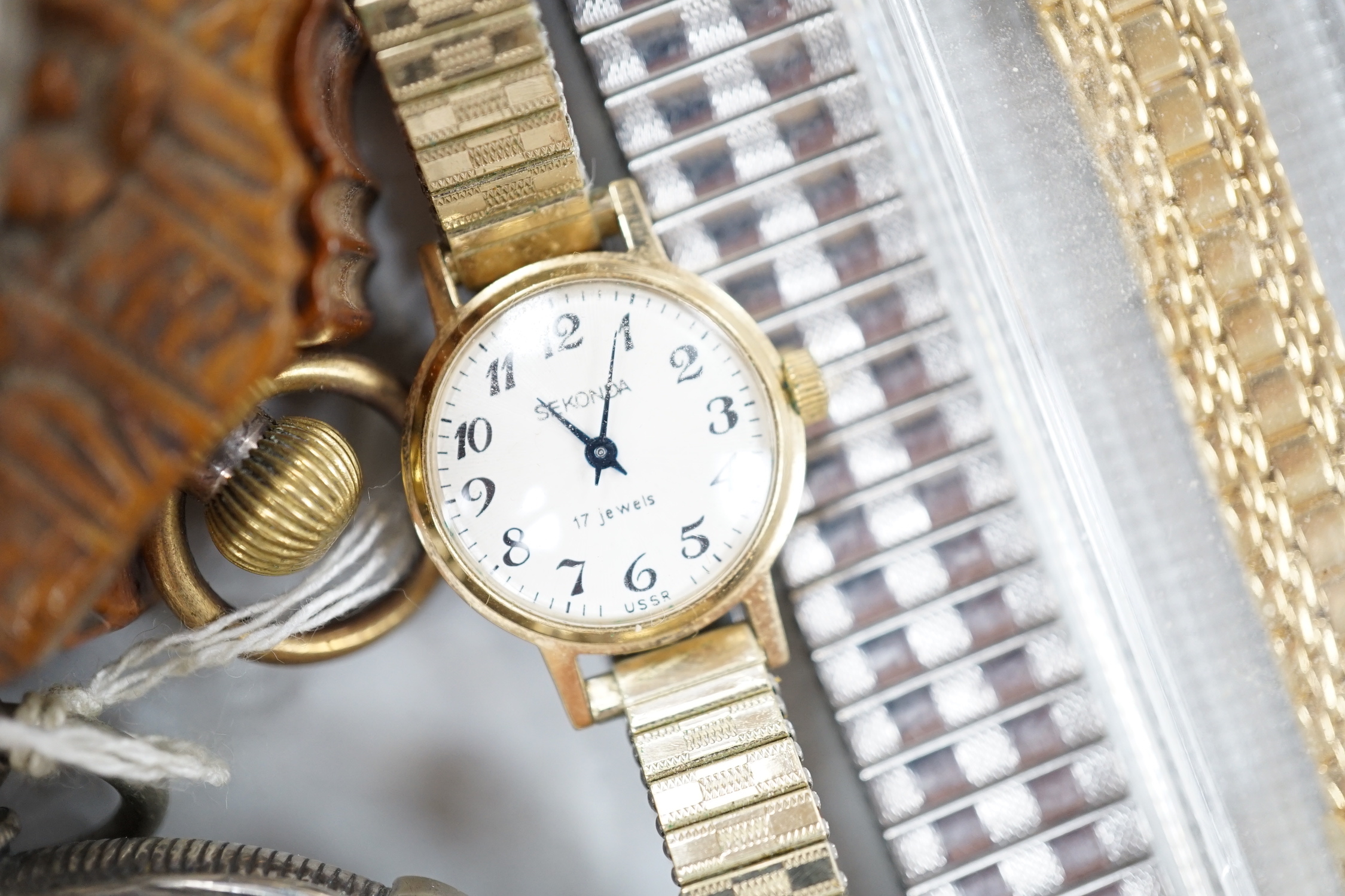 Twenty one assorted silver or base metal pocket watches including Waltham and Child of Birmingham, three wrist watches and a silver vesta case.